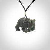 This picture shows a pendant that we designed in New Zealand jade. It is a little green bear that has a walking stance and is carved in detail. A really attractive and eye-catching piece of handmade jewellery. The cord is hand plaited braid and the length can be adjusted.
